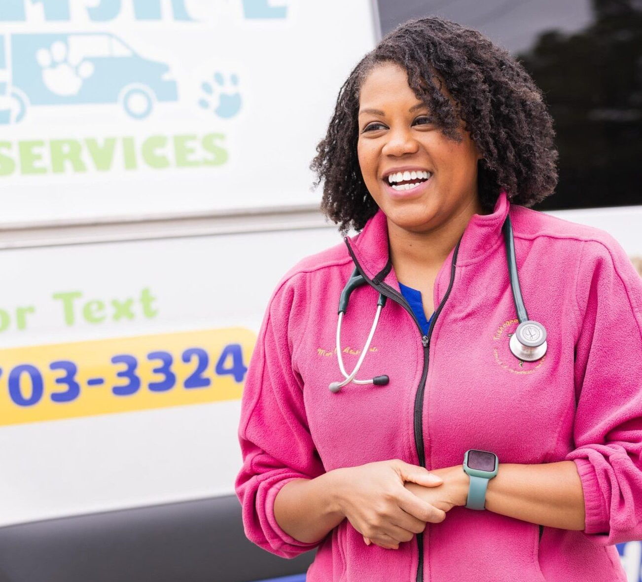 Woman smiling in front of vehicle